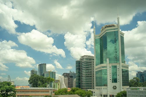 binalar, bulutlu gökyüzü, ho chi minh city içeren Ücretsiz stok fotoğraf