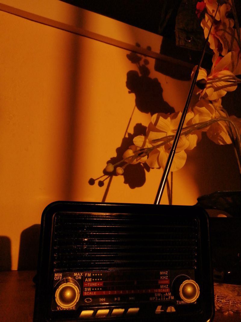 Vintage radio glowing in warm light