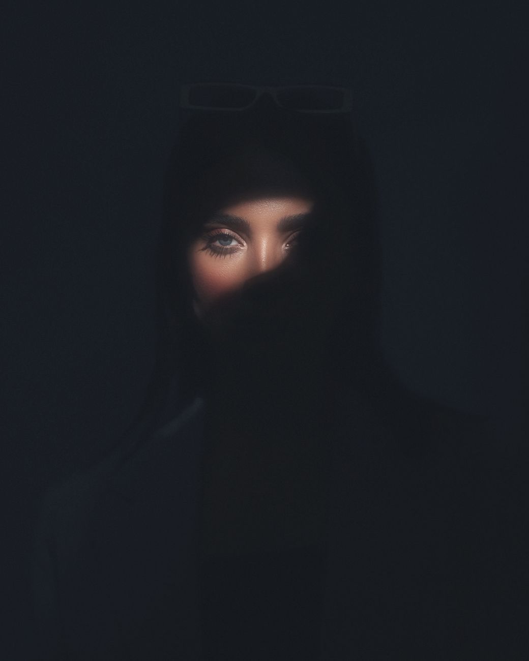 Captivating portrait capturing a woman's eye in dramatic lighting, Istanbul.