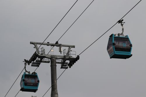 Free Cable cars in Ciudad de México captured against a gray sky, showcasing urban transportation. Stock Photo