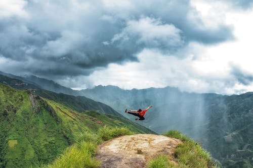 Free Person Practicing Martial Arts on Top of a Mountain Stock Photo