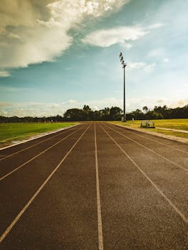 A vibrant outdoor running track on a sunny day, perfect for athletics.