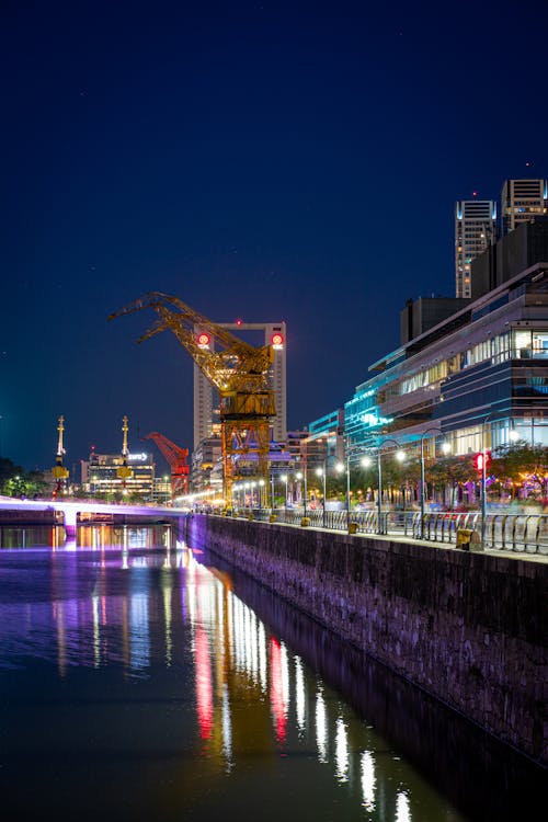 Tower Cranes near a Canal