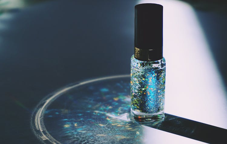 Closed Blue Glitter Nail Polish Bottle