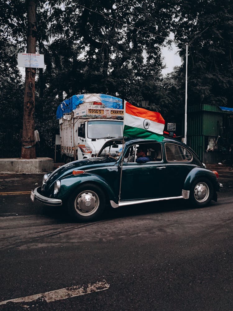 Photo Of A Car With The Flag Of India