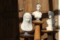 A Variety of Sculptures by a Wooden Door