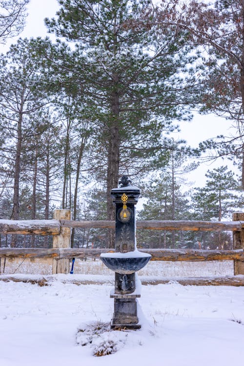 A Water Fountain on Snow Covered Ground