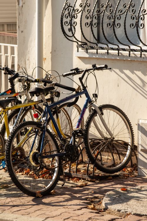 Free Bicycles parked on a sunlit sidewalk in İstanbul, Turkey. Stock Photo