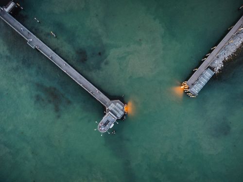 Free Aerial drone shot of a dock in Friedrichshafen, Germany, showcasing serene teal waters. Stock Photo