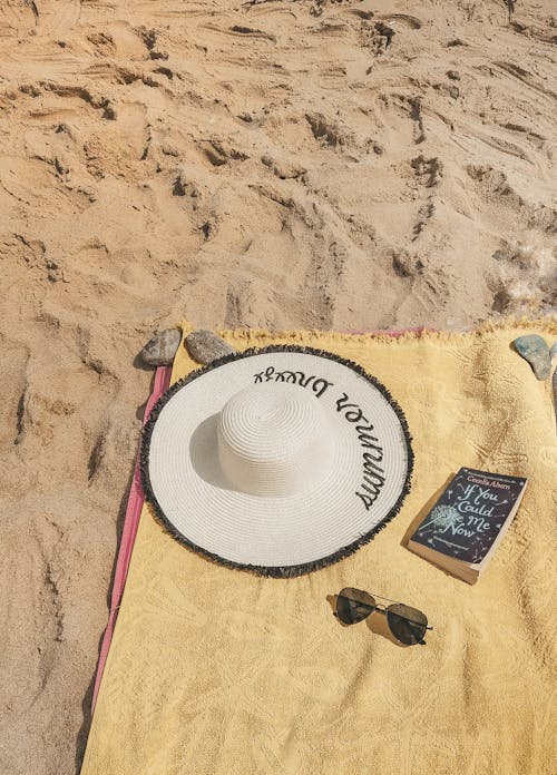 A Beach Towel Spread over the Sand