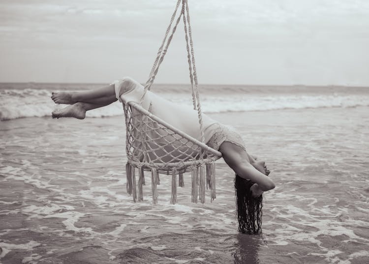 Black And White Photo Of Woman On A Hammock