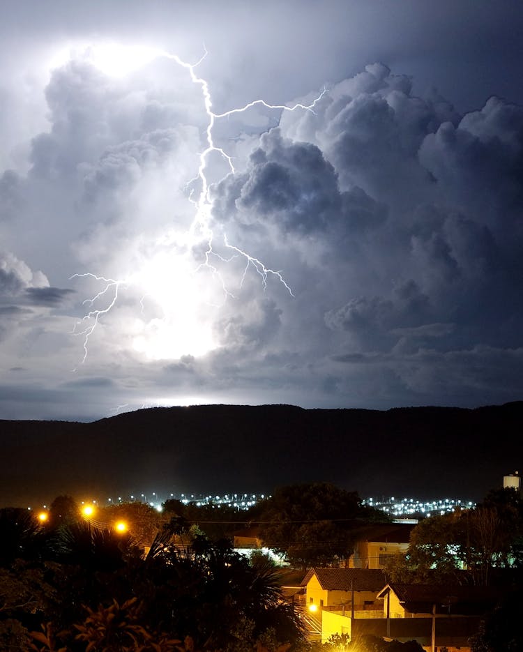 Lightning And Storm Clouds Over Houses