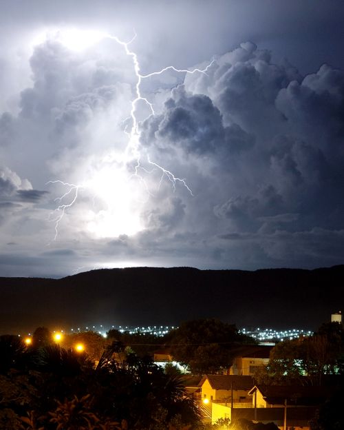 Free Intense lightning storm illuminating the night sky over Palmas, Brazil neighborhood. Stock Photo