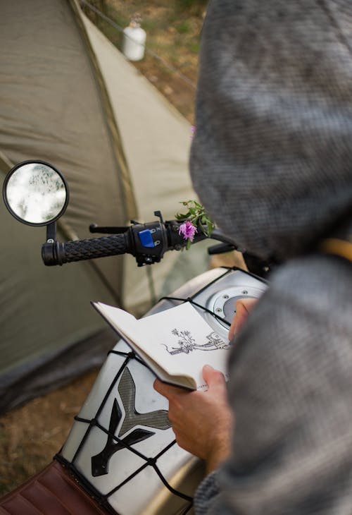 A Person Drawing on a Paper