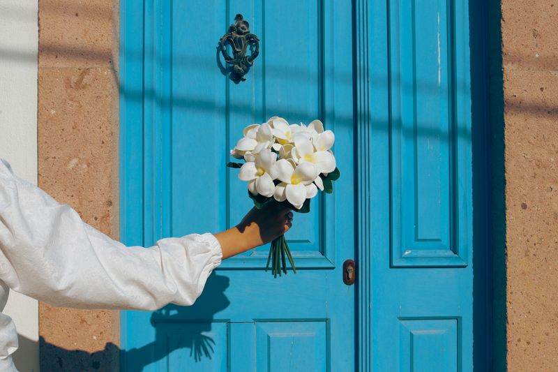 Fresh flower bouquet being delivered to a Charleston doorstep