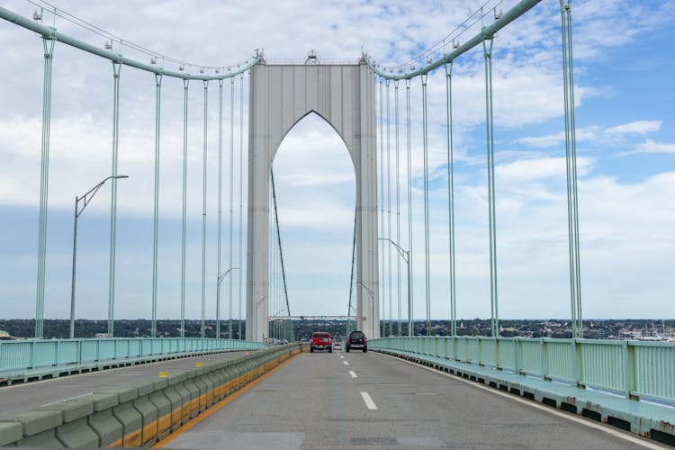 Moving Cars On Newport Bridge Under Blue Sky