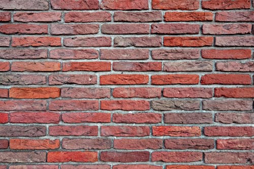 Free A Wall Made of Bricks and Cement Stock Photo