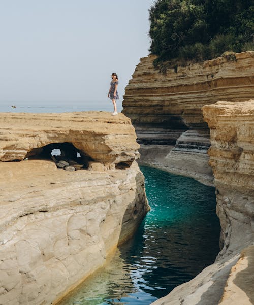 A Woman Standing on a Cliff in Sidari, Corfu