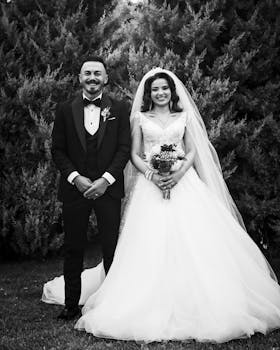 Beautiful black and white portrait of a smiling bride and groom outdoors.