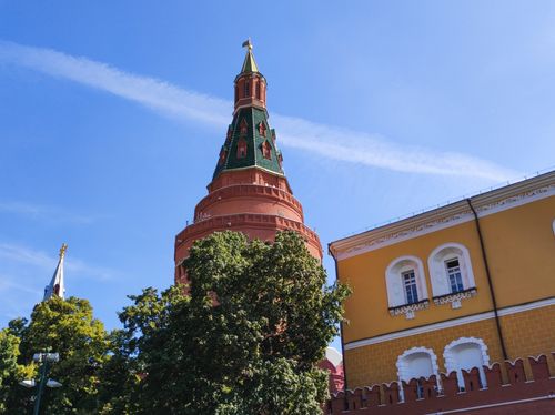 Free Low angle view of a historic Kremlin tower in Moscow, featuring architectural details and a clear blue sky. Stock Photo