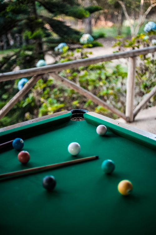 Free An outdoor billiard table with vibrant balls under natural light for leisure and fun. Stock Photo
