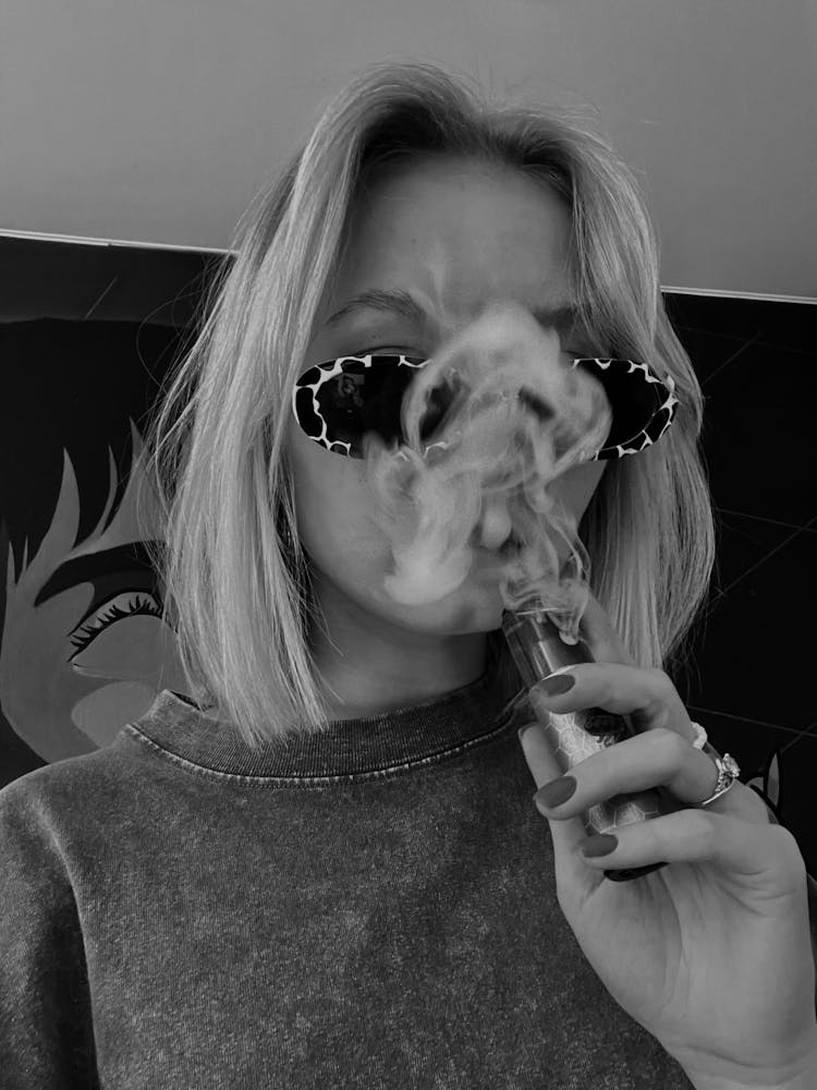 A Woman Smoking E Vape