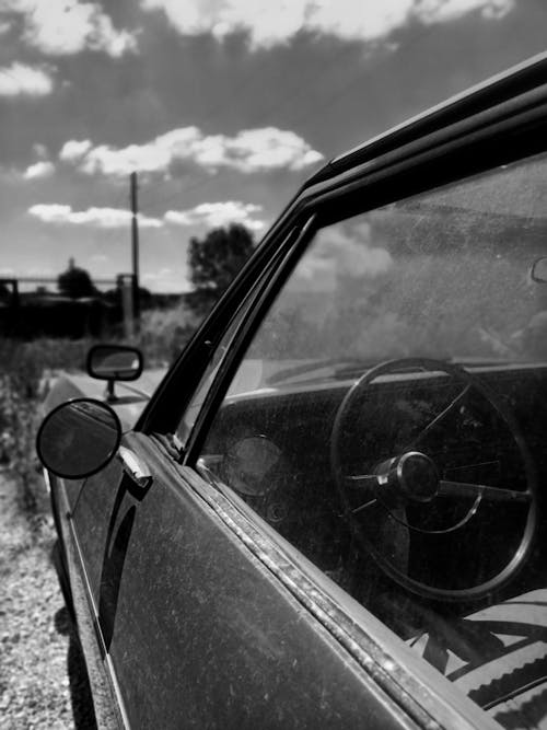 Grayscale Photo of a Vintage Car Side Mirror