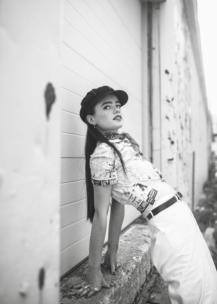 Woman Posing In Front Of Warehouse Door 