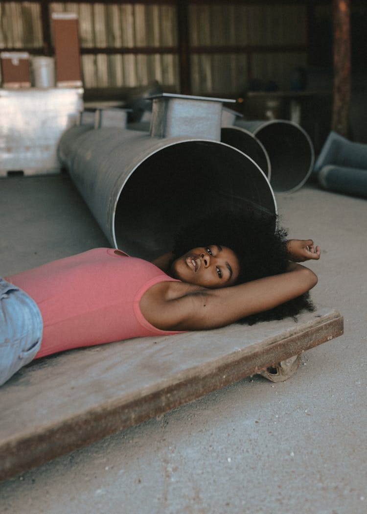 Woman Lying In A Garage And Posing 