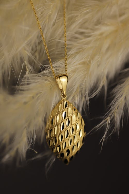 Close Up Photo of a Gold Necklace
