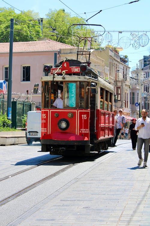 Red Tram Moving on the Street