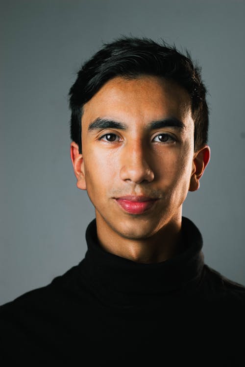 Close Up Photo of Man in Black Turtleneck Shirt