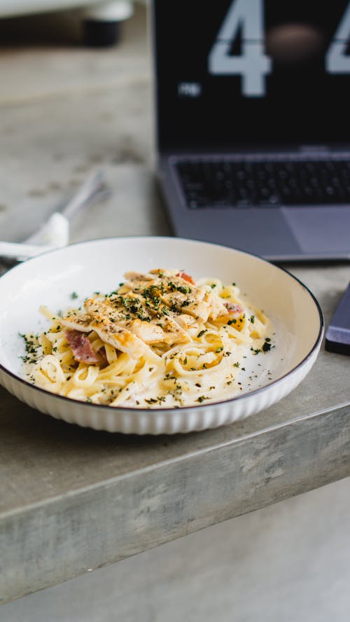 Free A Plate of Chicken and Mushroom Fettucine Stock Photo