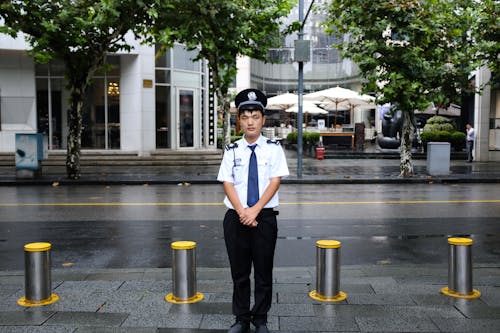 Man Standing Near Road