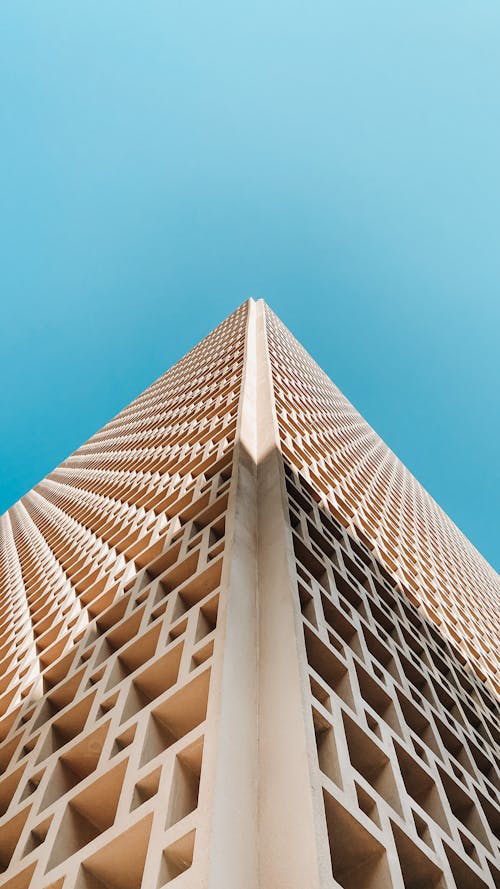 A Low Angle Shot of a Building Under the Blue Sky