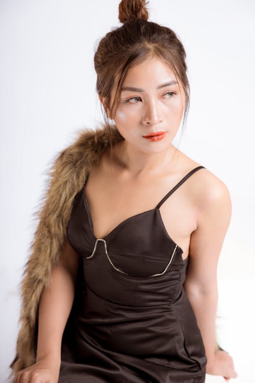 Woman Posing in a Black Lingerie and Fur