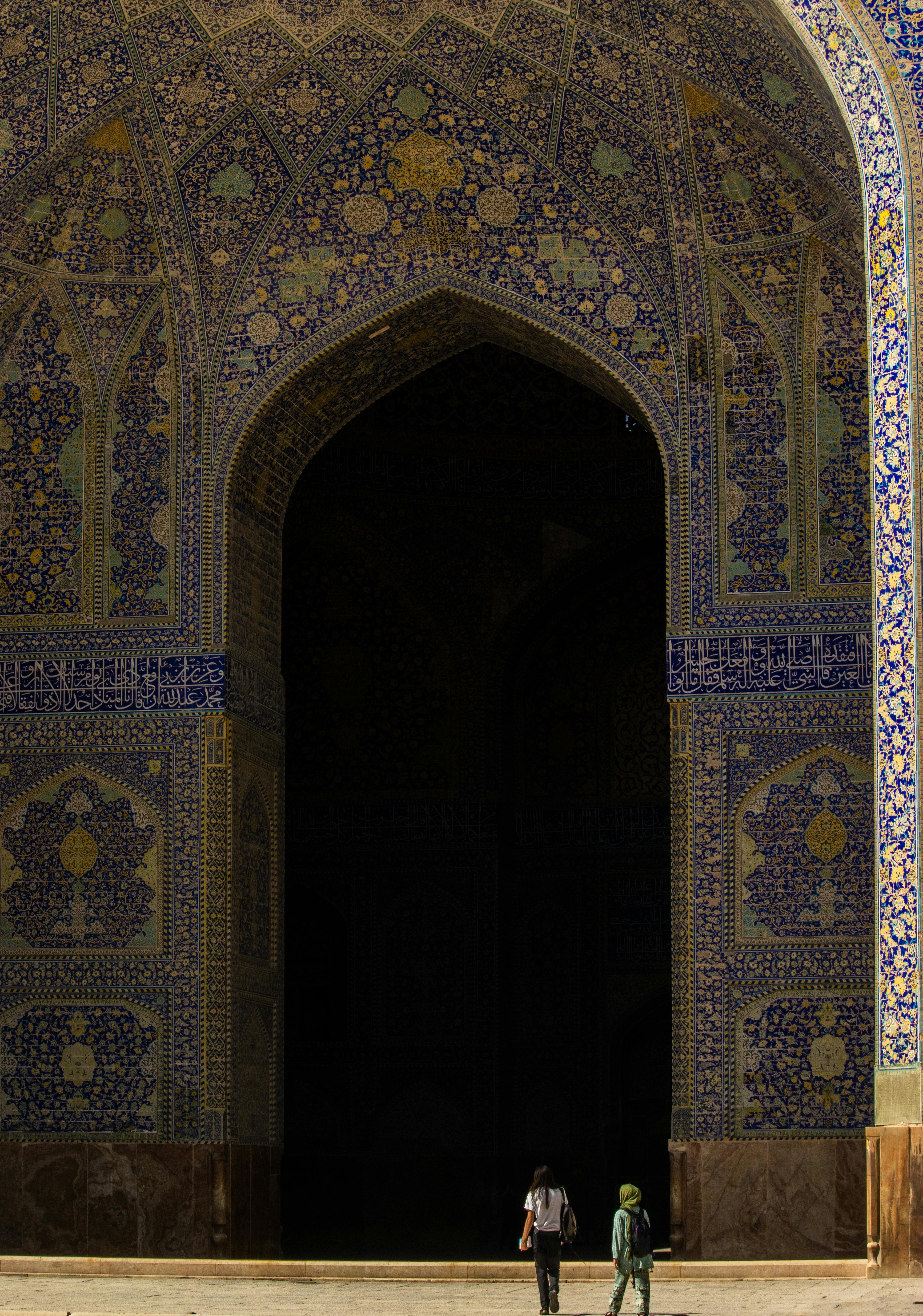 people walking near the mosque