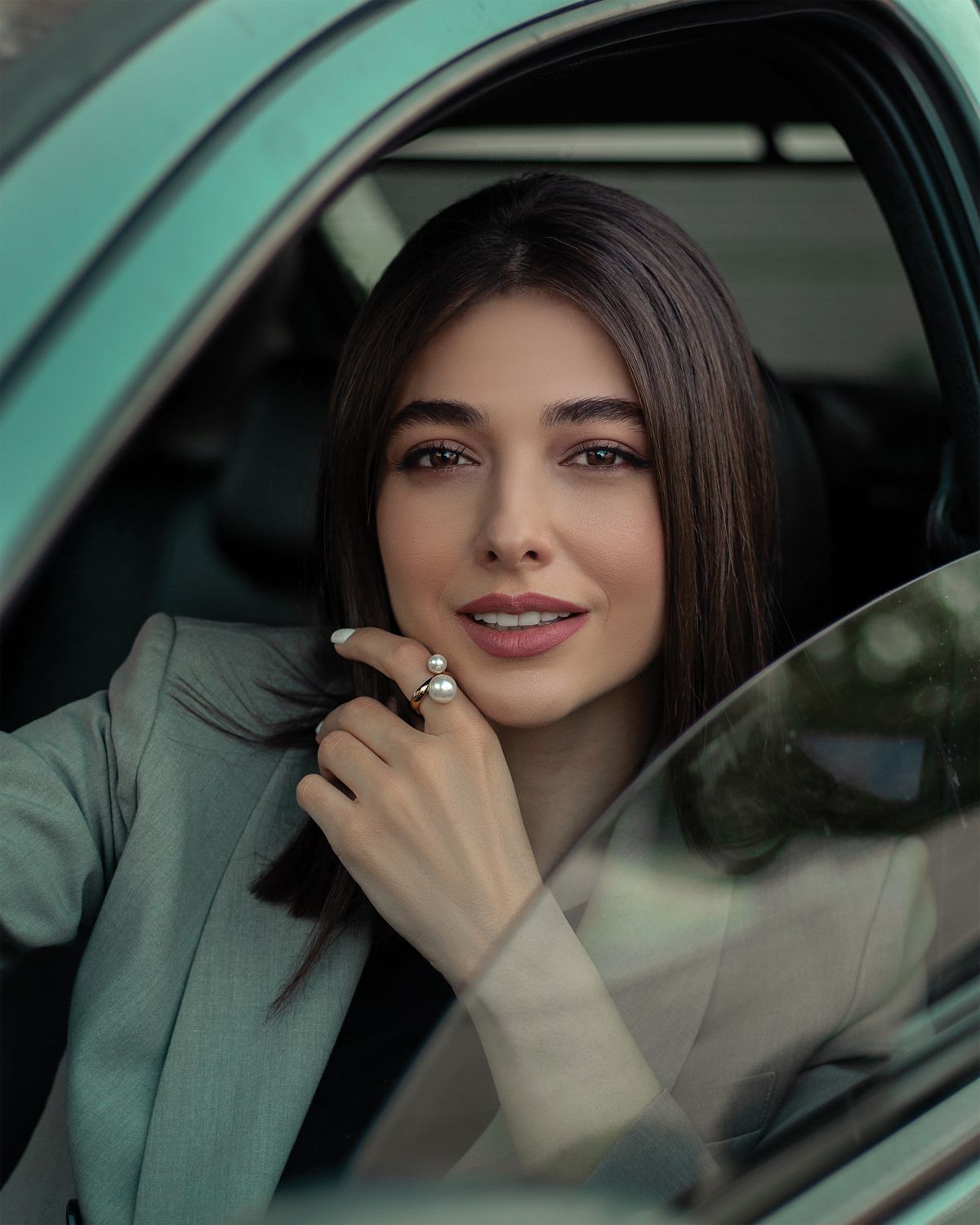 Beautiful Brunette Woman Sitting in the Car · Free Stock Photo