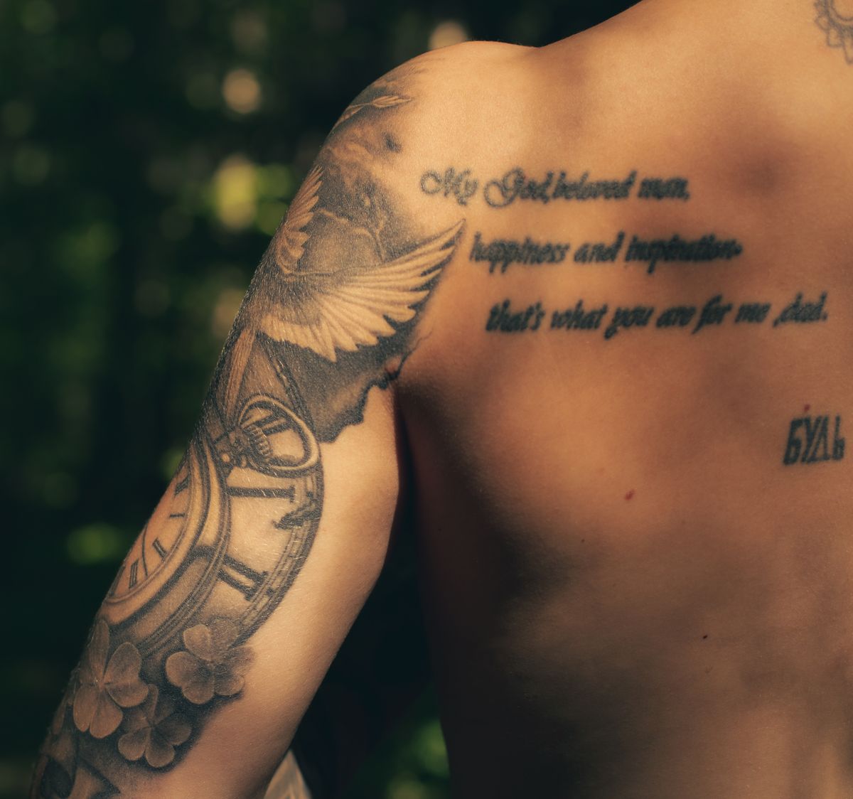 Script lettering tattoo on a shoulder