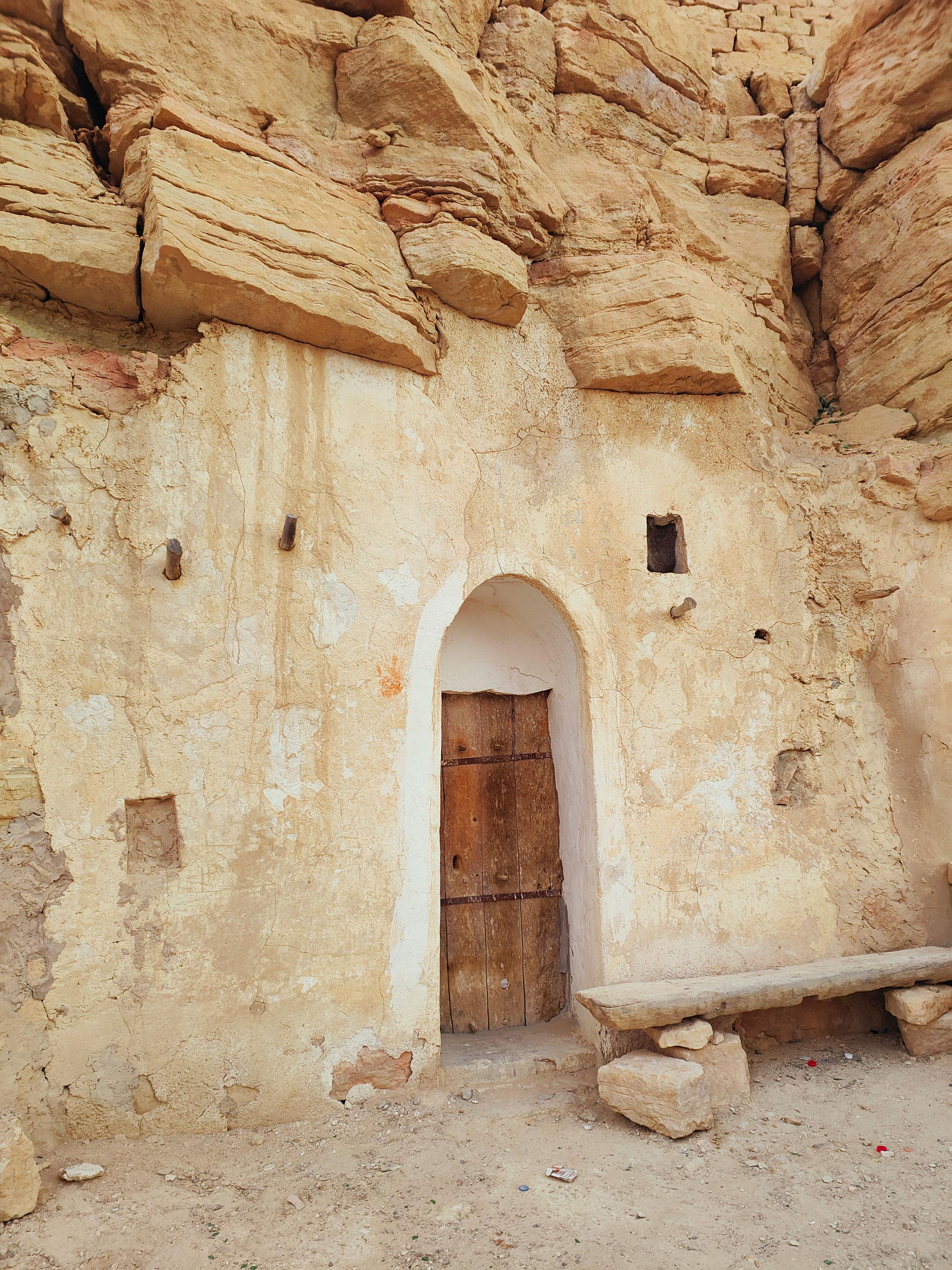 Free Brown Wooden Door on Brown Concrete Wall Stock Photo