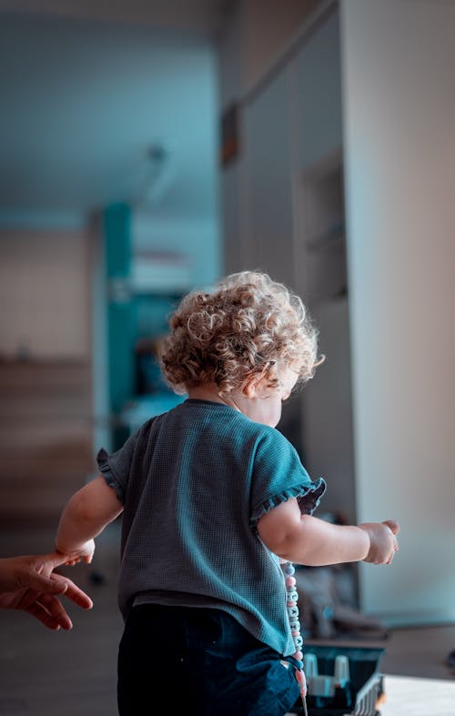 A Toddler with a Curly Hair