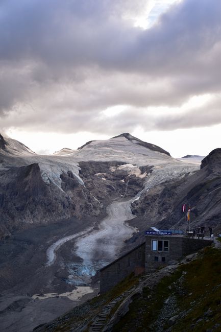Scenic view of snow-covered mountains under a cloudy sky in Fusch an der Großglocknerstraße, Salzburg, Austria.