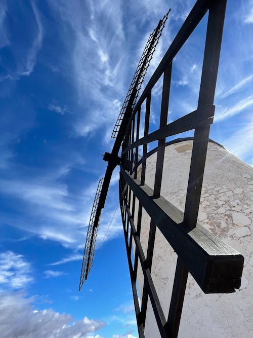 Low Angle Shot of Windmill Under Blue Sky 