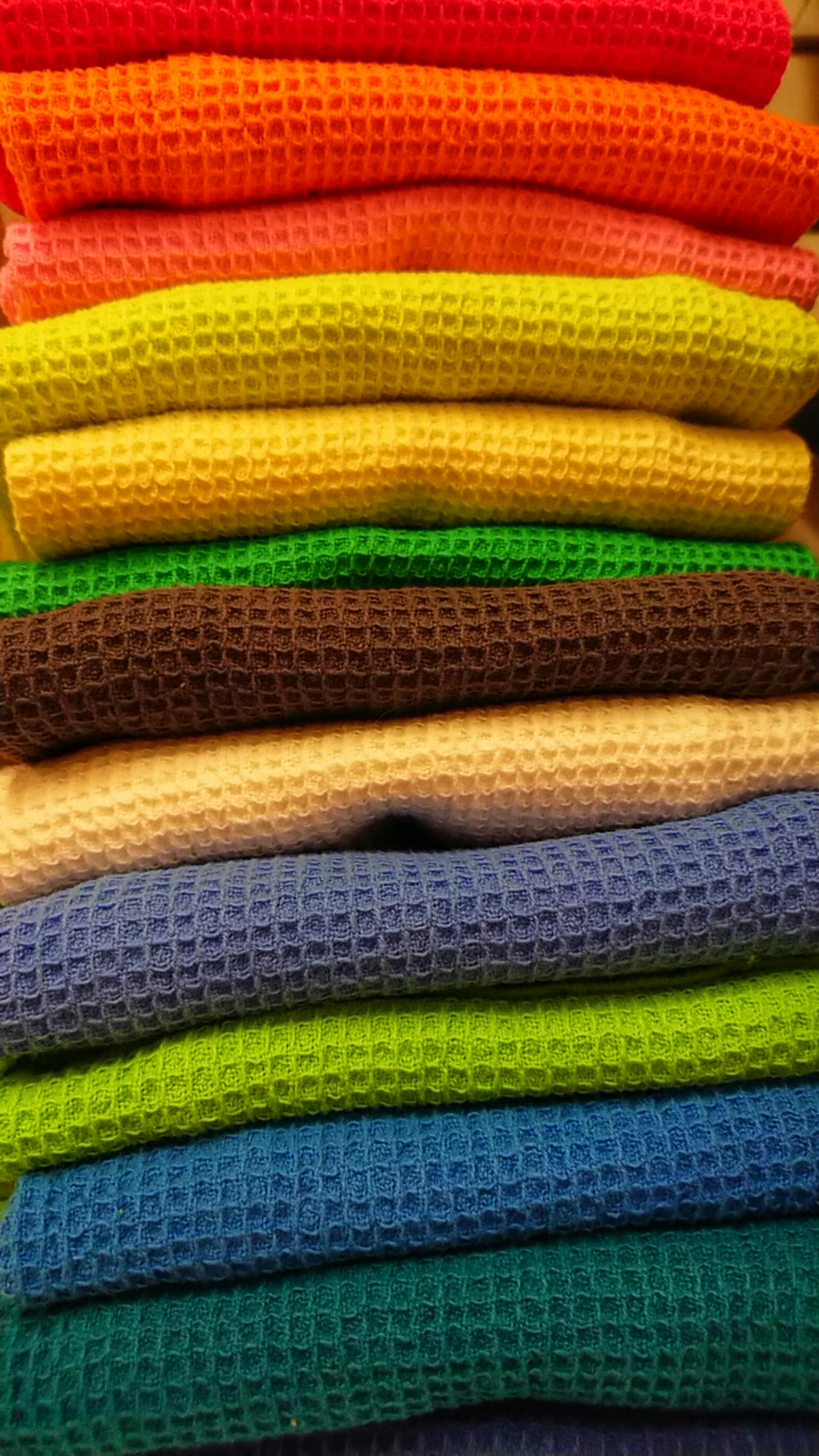 Free stock photo of cloths colors yellow orange green blue stack repet