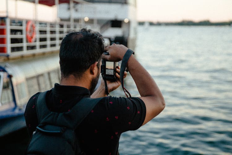 Man Photographing Sea