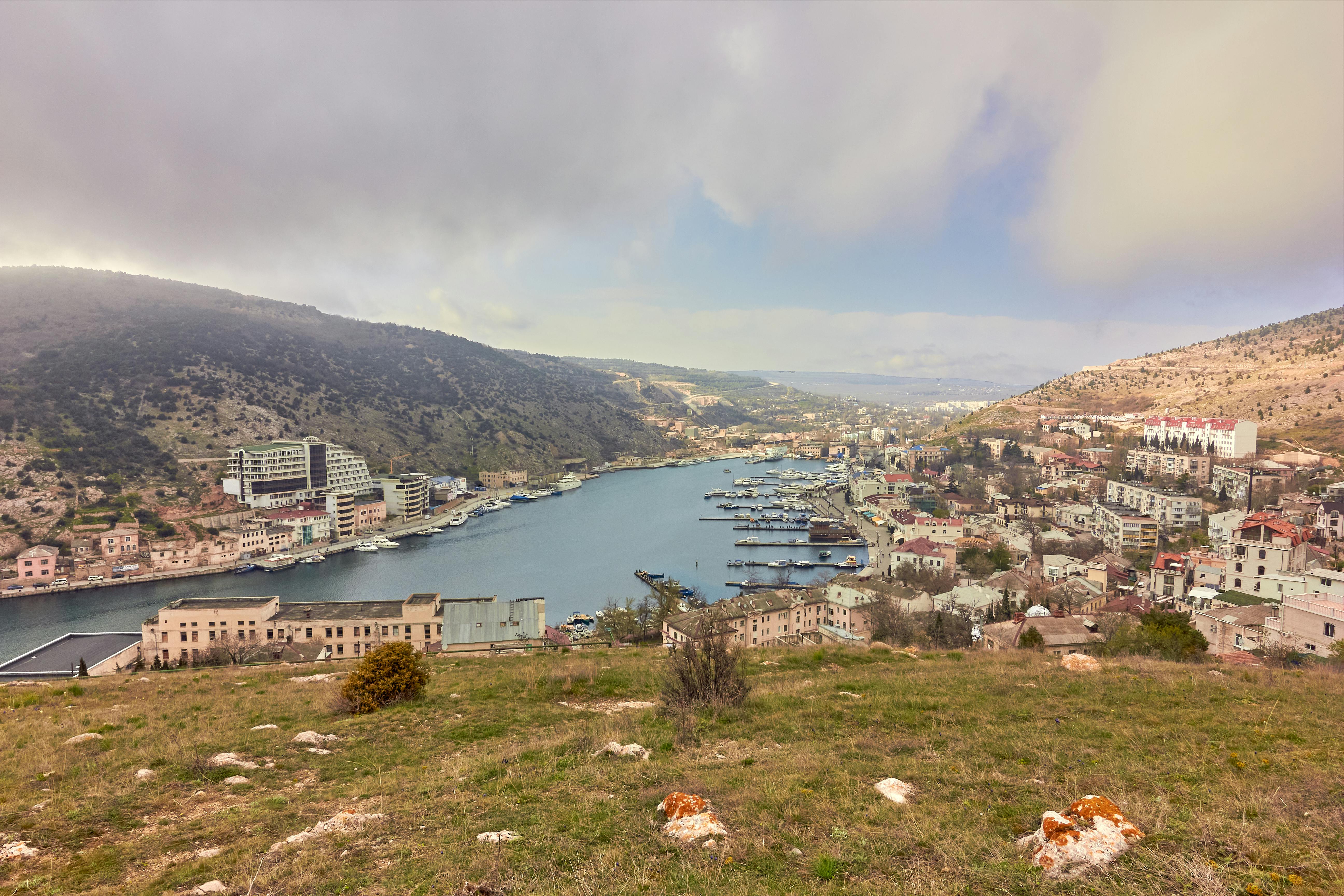 Free Aerial view of Balaklava Bay surrounded by hills and town in Crimea, Ukraine. Stock Photo