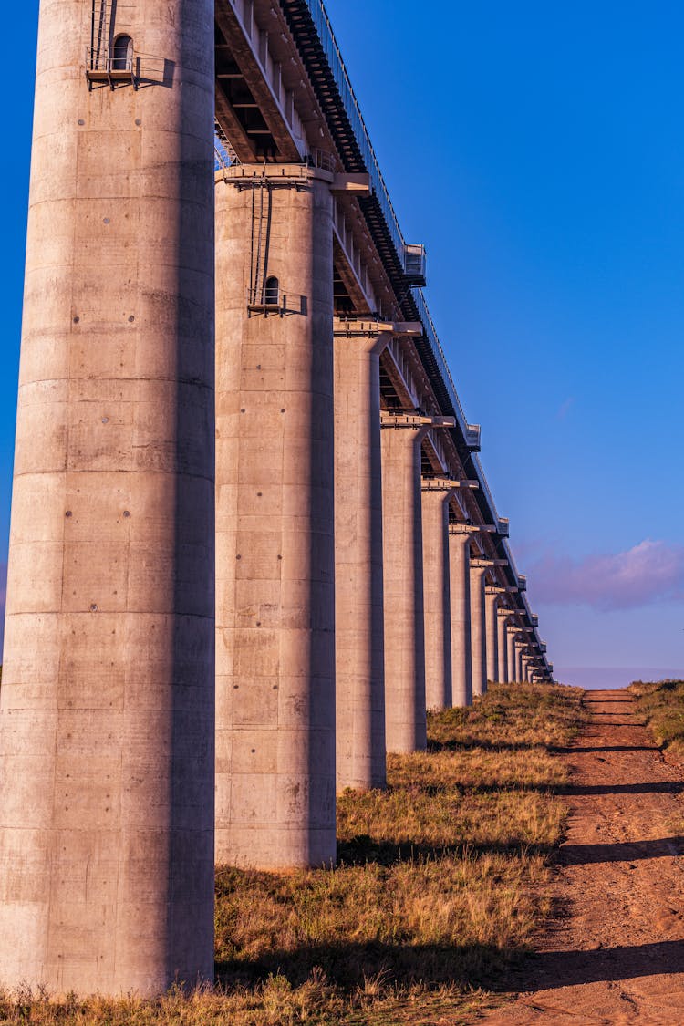 Bridge Pillars Of An Elevated Railway Line Under Blue Sky