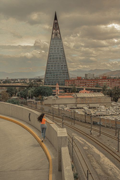 Free Cityscape of Mexico City featuring unique triangular tower and urban landscape. Stock Photo