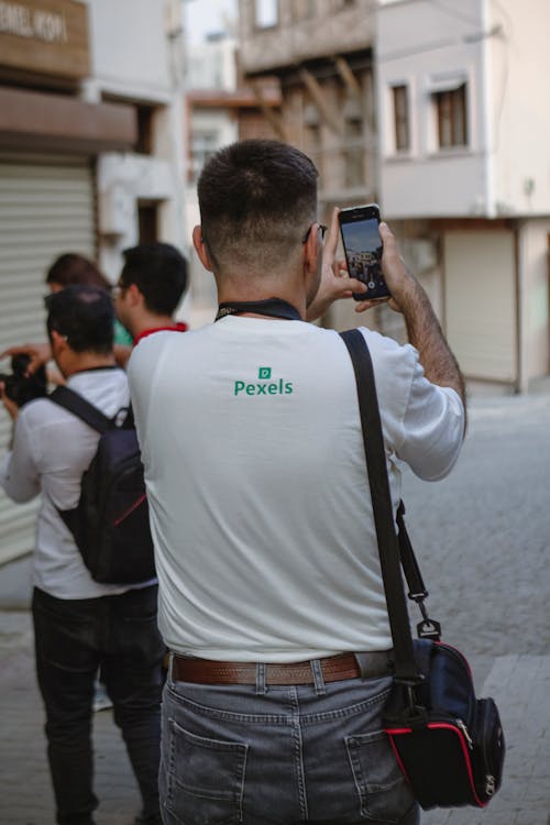 Man Taking Video using Mobile Phone