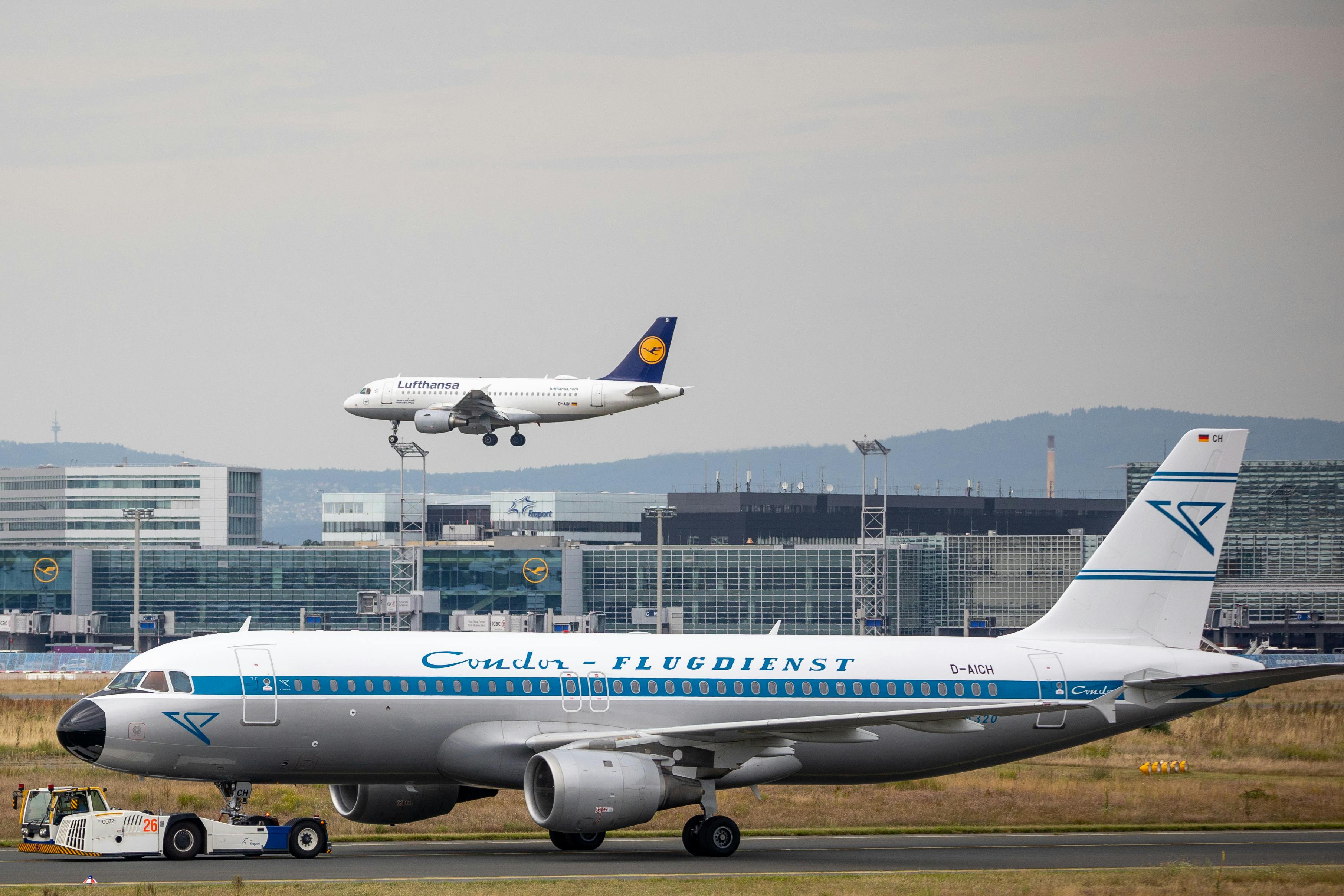 Free Two airplanes on the runway at Frankfurt Airport, Germany. Stock Photo